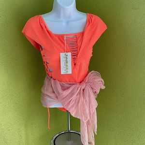 TiniBikini Swimwear. The coverup is a complimentary gift with your purchase.